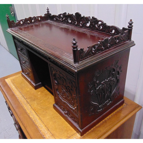 9 - A 19th century oriental rectangular carved wooden desktop bureau with scroll and pierced gallery abo... 