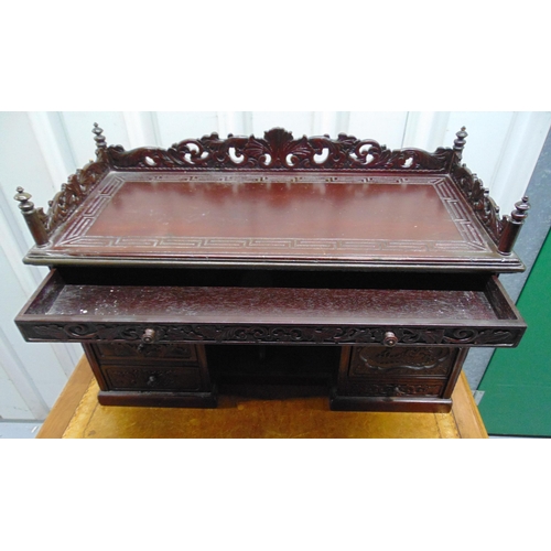 9 - A 19th century oriental rectangular carved wooden desktop bureau with scroll and pierced gallery abo... 