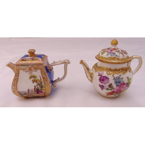 114 - Two continental hand painted miniature teapots decorated with 18th century scenes and floral cluster... 