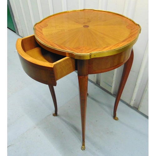 13 - A French Kingswood and mahogany circular brass bound occasional table with single drawer on four tap... 