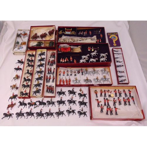 205 - A quantity of 1953 Britains Coronation figurines to include coaches, soldiers, animals and gun carri... 