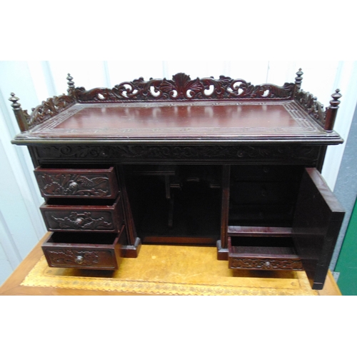 9 - A 19th century oriental rectangular carved wooden desktop bureau with scroll and pierced gallery abo... 