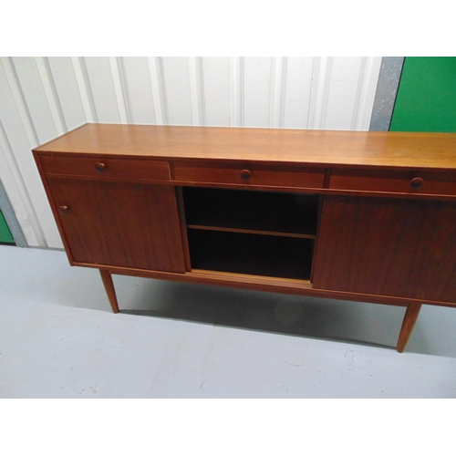 1 - G-Plan mid 20th century rectangular teak sideboard with cupboards and drawers on four tapering cylin... 