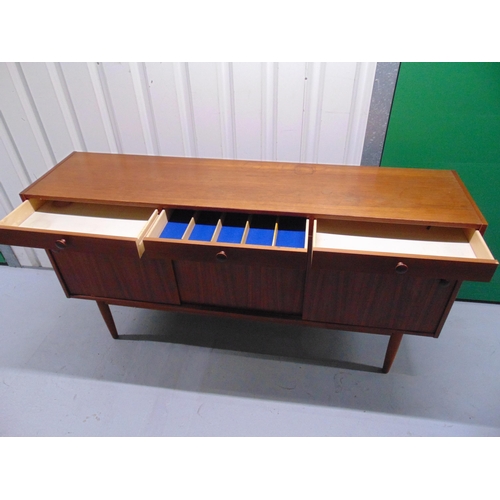 1 - G-Plan mid 20th century rectangular teak sideboard with cupboards and drawers on four tapering cylin... 