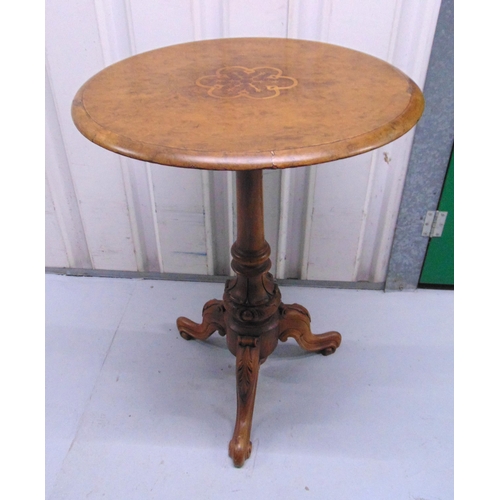 10 - A mahogany circular inlaid occasional table on three scroll legs, 70 x 53cm