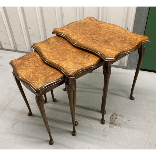 11 - A nest of rectangular mahogany and walnut tables on cabriole legs, tallest 54 x 55 x 39cm