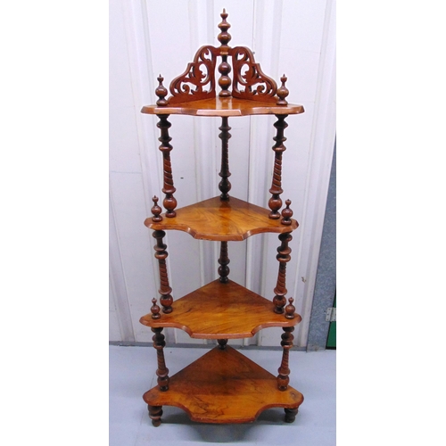 12 - A Victorian mahogany four tier whatnot, scroll pierced and turned baluster supports, 138 x 60cm