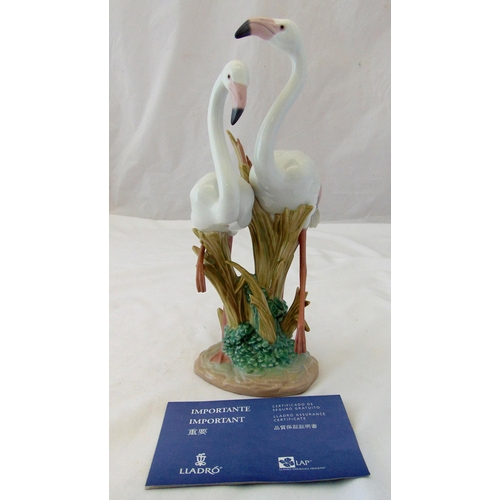 132 - Lladro figural group of flamingos on naturalistic base, marks to the base, 34cm (h)