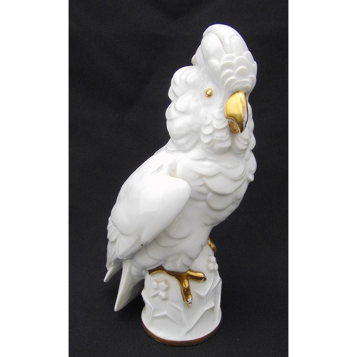 134 - Rosenthal figurine of a parrot, with gilded beak, eyes and claws, marks to the base, A/F