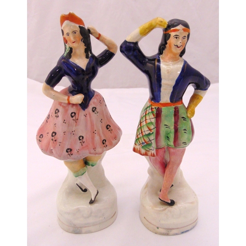 139 - A pair of Staffordshire flatback figures of a Scottish man and woman dancing, 23.5cm (h)