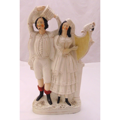 140 - A Staffordshire figural group of Scottish musicians playing the accordion and harp, 43cm (h)