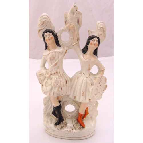 142 - A Staffordshire flatback figural group of a couple dancing on raised oval base, 29cm (h)