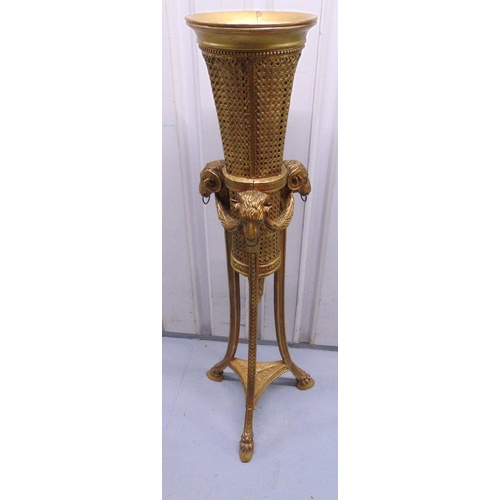 16 - A gilded wooden and rattan plant stand of tapering cylindrical form with Ram mask and hoof outswept ... 