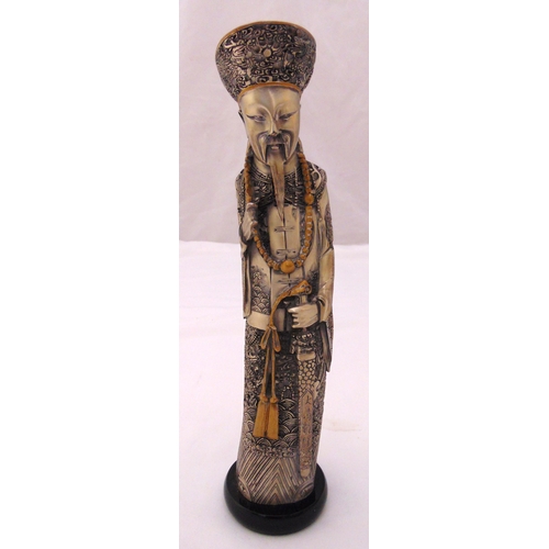 189 - An oriental silvered figurine of an elder in ceremonial robe on raised circular base,  29cm (h)