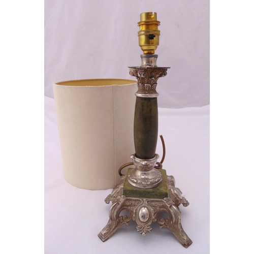 23 - A silver plate and faux marble table lamp of Corinthian column form on raised scroll pierced square ... 