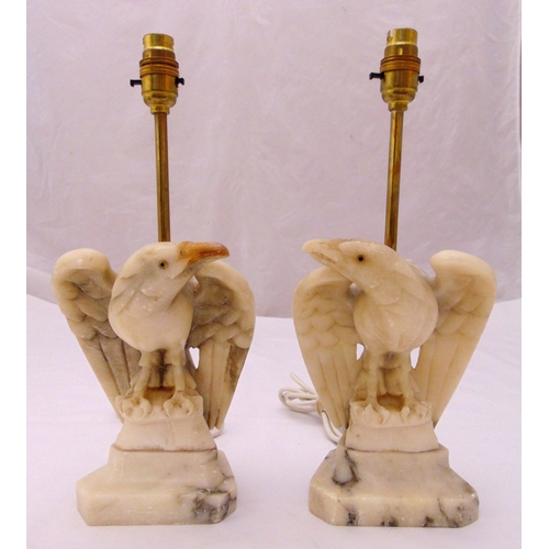 28 - A pair of carved marble table lamps in the form of eagles on raised rectangular plinths, 38.5cm (h) ... 