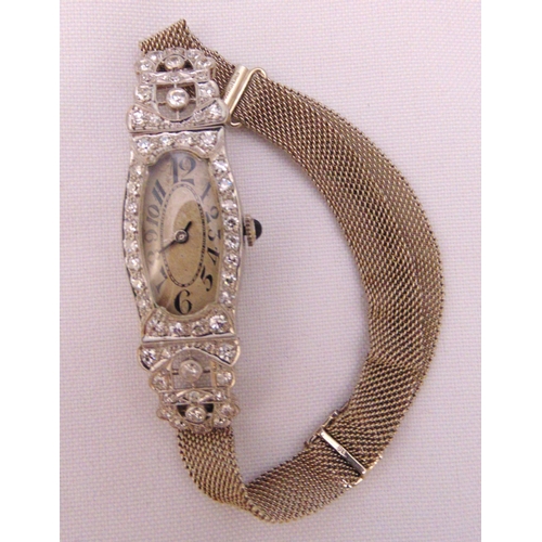 287 - An Art Deco platinum ladies wristwatch with diamond bezel on a 9ct gold bracelet, approx total weigh... 