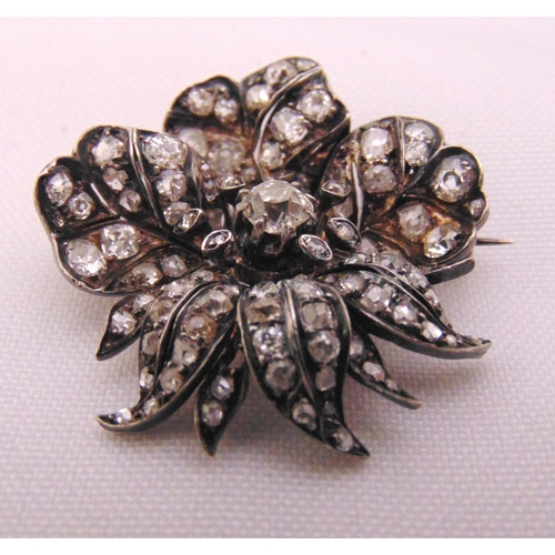 299 - A Victorian diamond flower brooch set with old cut diamonds