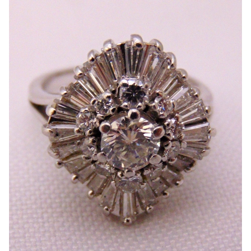 305 - Platinum and diamond dress ring, central diamond approx 40 points, surrounded by ten three point dia... 