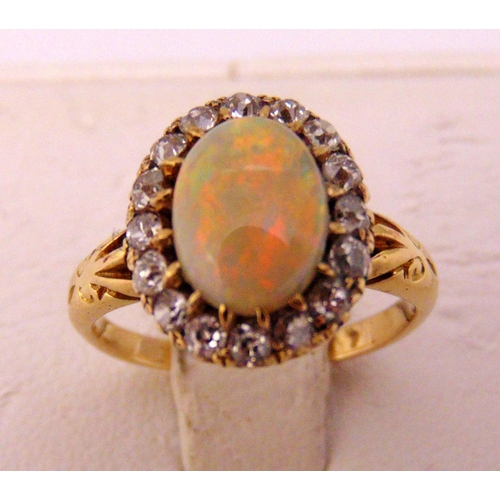 312 - A yellow gold opal and diamond ring, approx total weight 3.1g