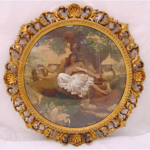 34 - A circular polychromatic print of a reclining female within a gilded and pierced style picture frame... 