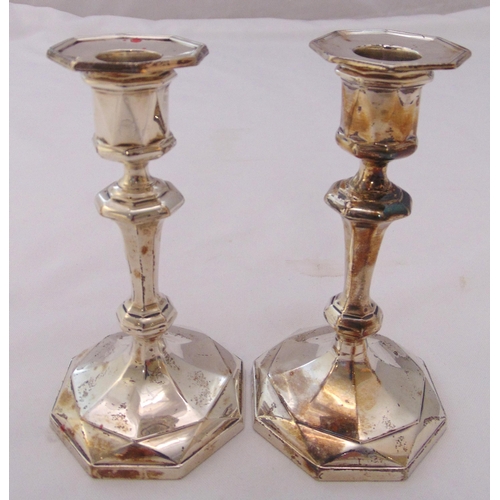 364 - A pair of hallmarked silver table candlesticks, Georgian style on raised octagonal bases, Birmingham... 