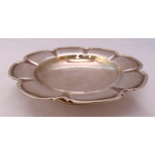 373 - A Mappin and Webb hallmarked silver fruit dish, shaped circular with moulded border on circular spre... 