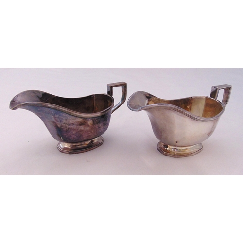 377 - A pair of hallmarked silver sauce boats, oval, panelled, reeded borders with angled handles, Sheffie... 