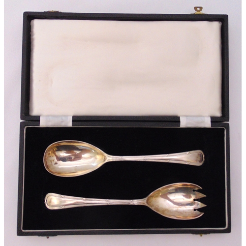 379 - A cased set of hallmarked silver salad servers, reed and tie borders, Sheffield 1947, approx total w... 