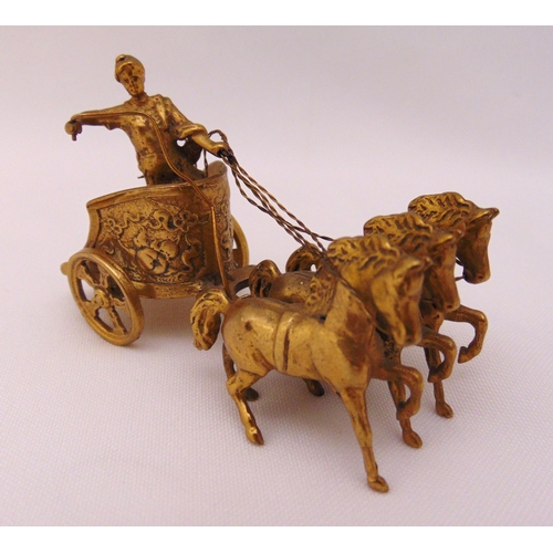 386 - A hallmarked silver gilt model of a chariot driven by three horses, London 1966, approx total weight... 