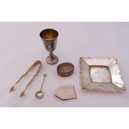 390 - A quantity of hallmarked silver to include a Kiddush cup, a pill box, a money clip and a toothpick (... 