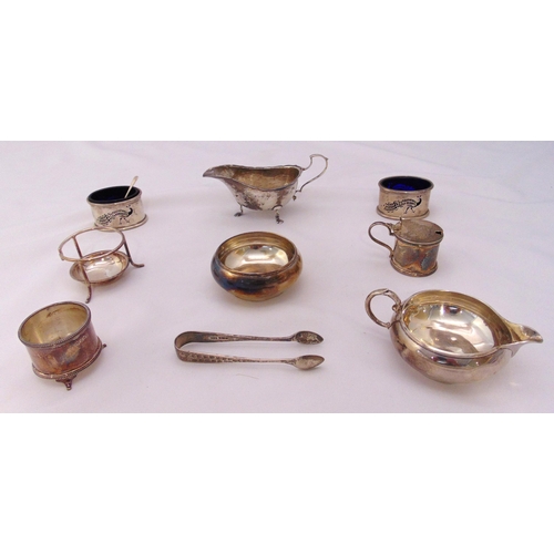 391 - A quantity of hallmarked silver to include a sauce boat, a cream jug, a sugar bowl, a pair of sugar ... 