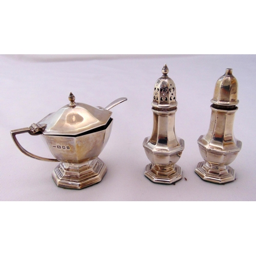 393 - A three piece hallmarked silver condiment set and a condiment spoon