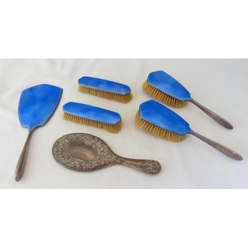 394 - A five piece hallmarked silver and enamel dressing table set to include a hand mirror, clothes and h... 