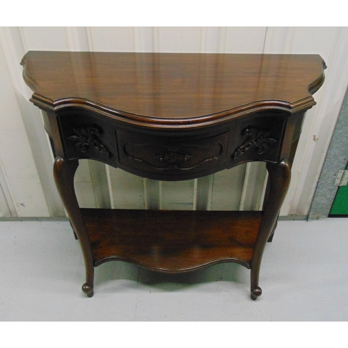 9 - A demi-lune games table with a single drawer on scroll legs and shaped oval base, 75.5 x 85.5 x 41cm