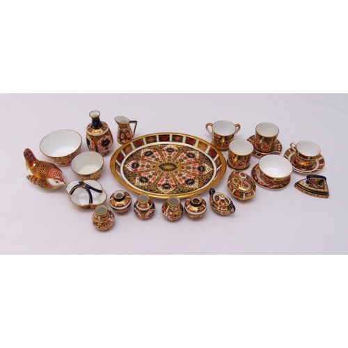 118 - A quantity of Royal Crown Derby Imari pattern miniatures to include an oval dish, cups, saucers and ... 