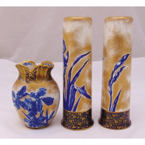 131 - A pair of Doulton tubular vases decorated with flowers and leaves and matching vase, tallest 28cm (h... 