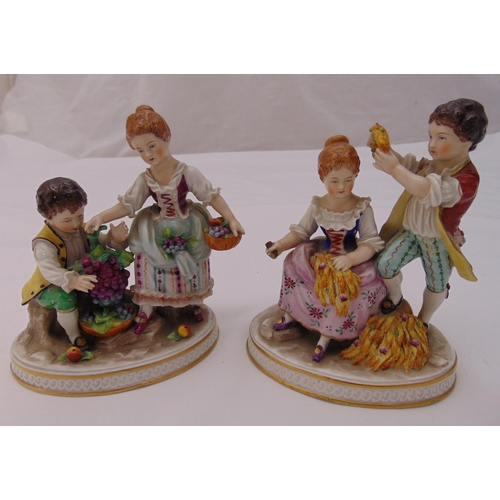 140 - A pair of Sitzendorf figurines of fruit sellers, marks to the bases, 15cm (h)