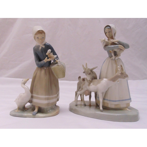 145 - Two Lladro figurines of farm girls with ducks and sheep, marks to the bases, tallest 25cm (h)