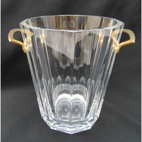153 - A Baccarat crystal ice bucket of tapering cylindrical form with faceted sides and gilt metal handles... 