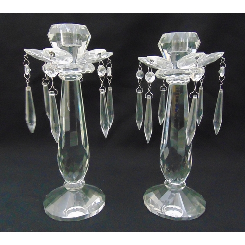 158 - A pair of crystal lustre candlesticks with drop pendants on raised circular bases, 27.5cm (h)