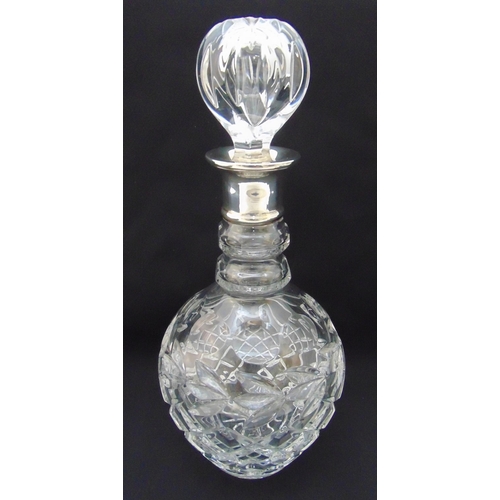 168 - A hallmarked silver and cut glass decanter with drop stopper, 28.5cm (h)