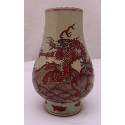 175 - A Chinese red under glazed baluster form dragon vase, 29cm (h)