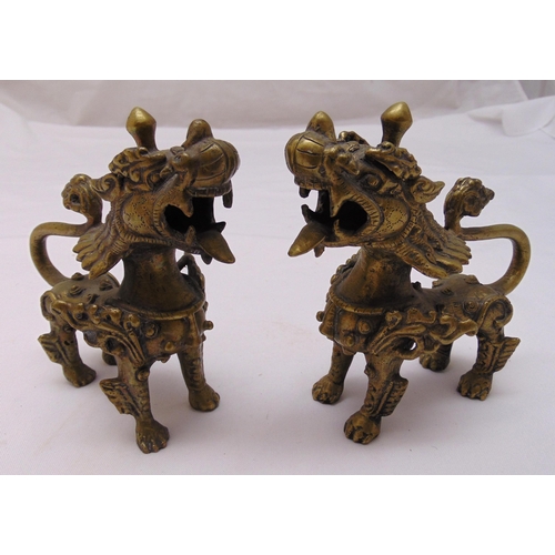 182 - A pair of oriental stylised brass lions, 15cm (h)