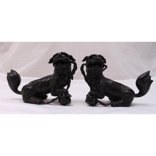 183 - A pair of Ming style bronze figurines of Dogs of Foe, 15cm (h)