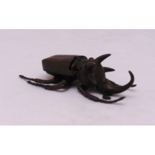 188 - A Japanese Okimono bronze figurine of a Rhino Beetle, 10cm (l)