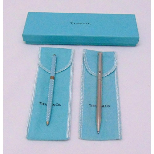 223 - Tiffany and Co white metal ball point pen in original packaging and a Tiffany and Co enamel and whit... 