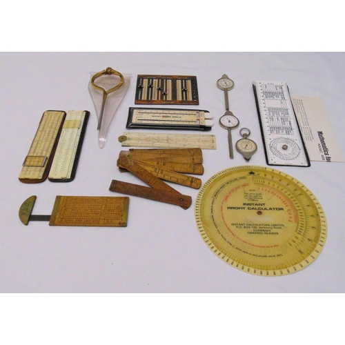 230 - A quantity of antique measuring equipment to include slide rules and gauges (13)