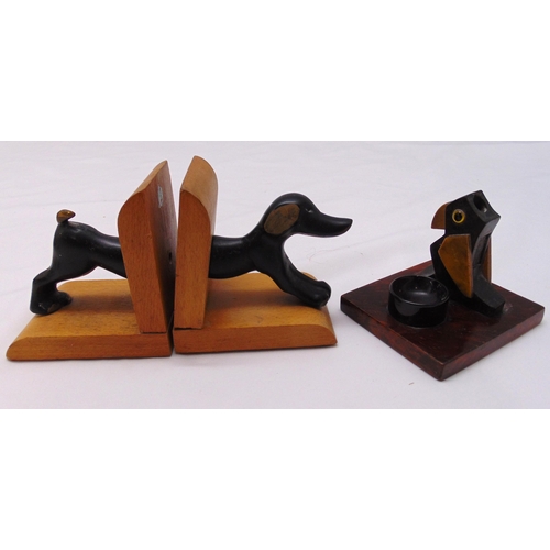 233 - A pair of bronze and wood dog bookends and an unusual 1930s vesta match striker