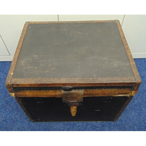 236 - A rectangular leather bound trunk with studded hinged cover to reveal lined interior